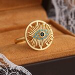 Gold Plated Ring with Eye Design and Sunburst Pattern in Blue and Black Stones for Women