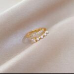 Gold Ring with Pearls and Stones - Double-Layered Band with White and Gold Design for Women - Image 3