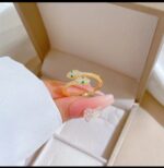 Gold Plated Snake Ring with Green and White Stones for Women - Fashion Jewelry for Party, Gift, and Everyday Wear