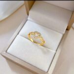 Gold Ring with Heart-shaped Design and Diamond-studded Loops for Women - Modern Jewelry for Gifting and Everyday Wear