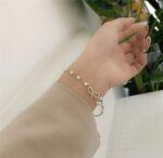 Elegant Pearl Bow Charm Bracelet - Image 2
