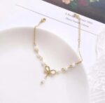 Elegant Pearl Bow Charm Bracelet