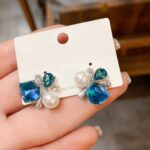 Elegant Blue Crystal Pearl Stud Earrings for Women, Statement Geometric Design with Teardrop Gemstones, Sparkling CZ Detailing and White Pearl Accents, Party Wear Fashion Jewellery