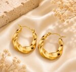 Elegant Gold Tone Twisted Hoop Earrings for Women Smooth Chunky Circular Statement Jewellery for Party Wedding Festive Ethnic and Everyday Wear