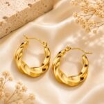 Elegant Gold Tone Twisted Hoop Earrings for Women Smooth Chunky Circular Statement Jewellery for Party Wedding Festive Ethnic and Everyday Wear