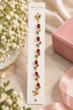 Elegant Gold-Tone Red Ruby Leaf Vine Bracelet for Women with Sparkling Red Gemstones and Green Leaf Accents, Floral-Inspired Statement Fashion Jewellery for Party, Wedding and Festive Wear