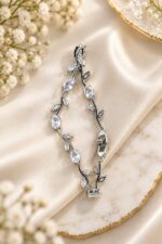 Elegant Silver-Tone Leaf Vine Bracelet for Women with Sparkling Clear Oval Crystals and Delicate Leaf Accents, Nature-Inspired Statement Fashion Jewellery for Party, Wedding, Festive and Everyday Wear