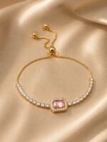 Elegant Gold-Tone Pink Crystal Tennis Bracelet for Women with Adjustable Bolo Chain, Sparkling Round Cubic Zirconia Style Stones and Central Cushion-Cut Pink Gemstone, Stylish Party Wear Fashion Jewellery