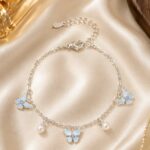 Elegant Silver-Tone Butterfly Charm Bracelet for Women with Blue Enamel Butterfly Charms, Pearl Dangle Accents and Delicate Chain Design, Adjustable Fashion Jewellery for Party, Casual, Festive and Everyday Wear